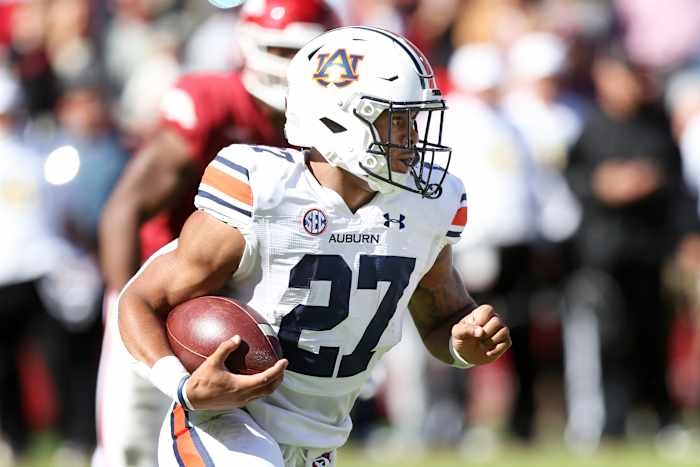 Oct 16, 2021; Fayetteville, Arkansas, USA; Auburn Tigers running back Jarquez Hunter (27) rushes during the first quarter against the Arkansas Razorbacks at Donald W. Reynolds Razorback Stadium. Mandatory Credit: Nelson Chenault-USA TODAY Sports